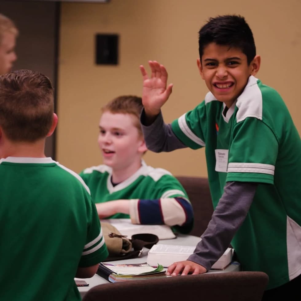 Kid raising his hand