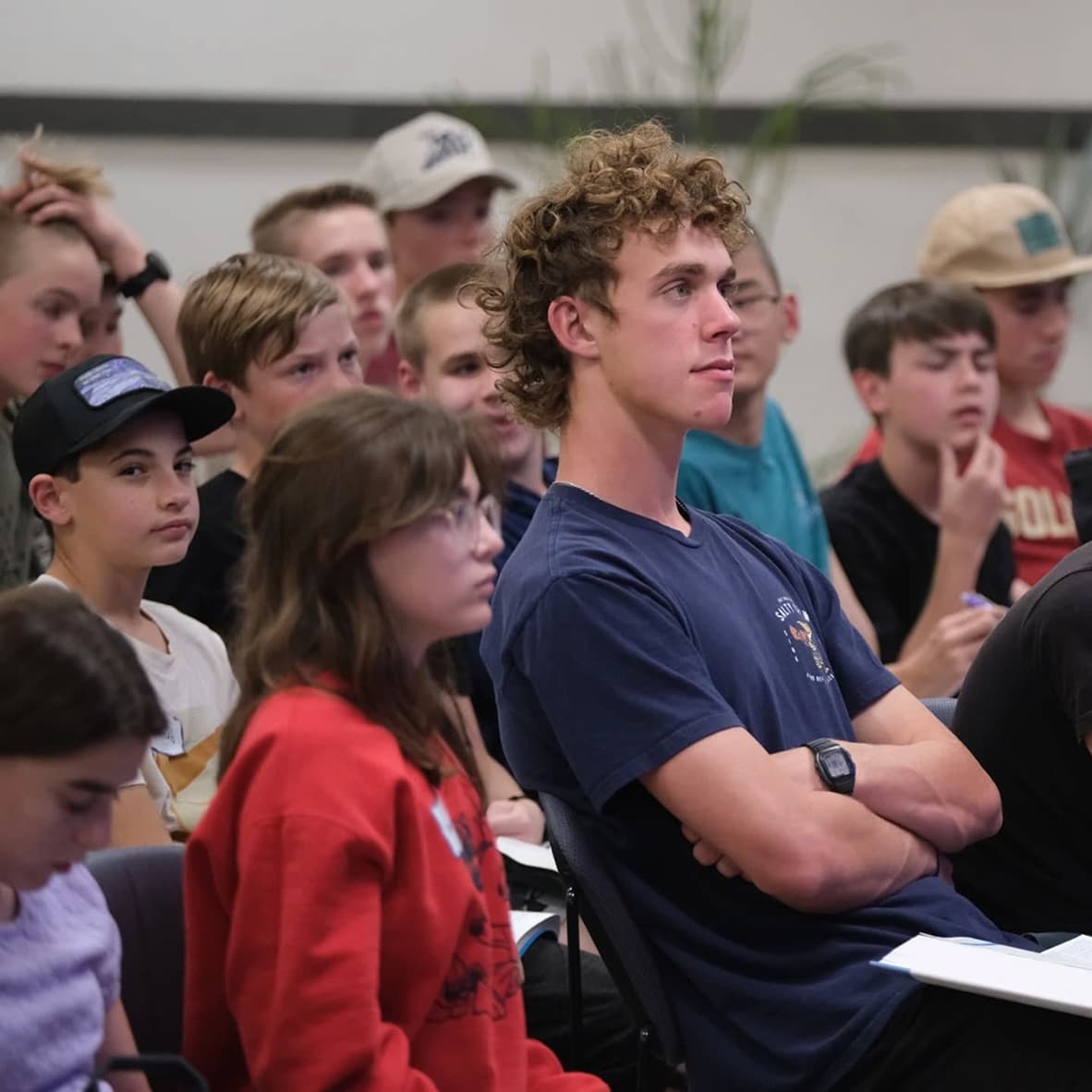 Students listening to a sermon