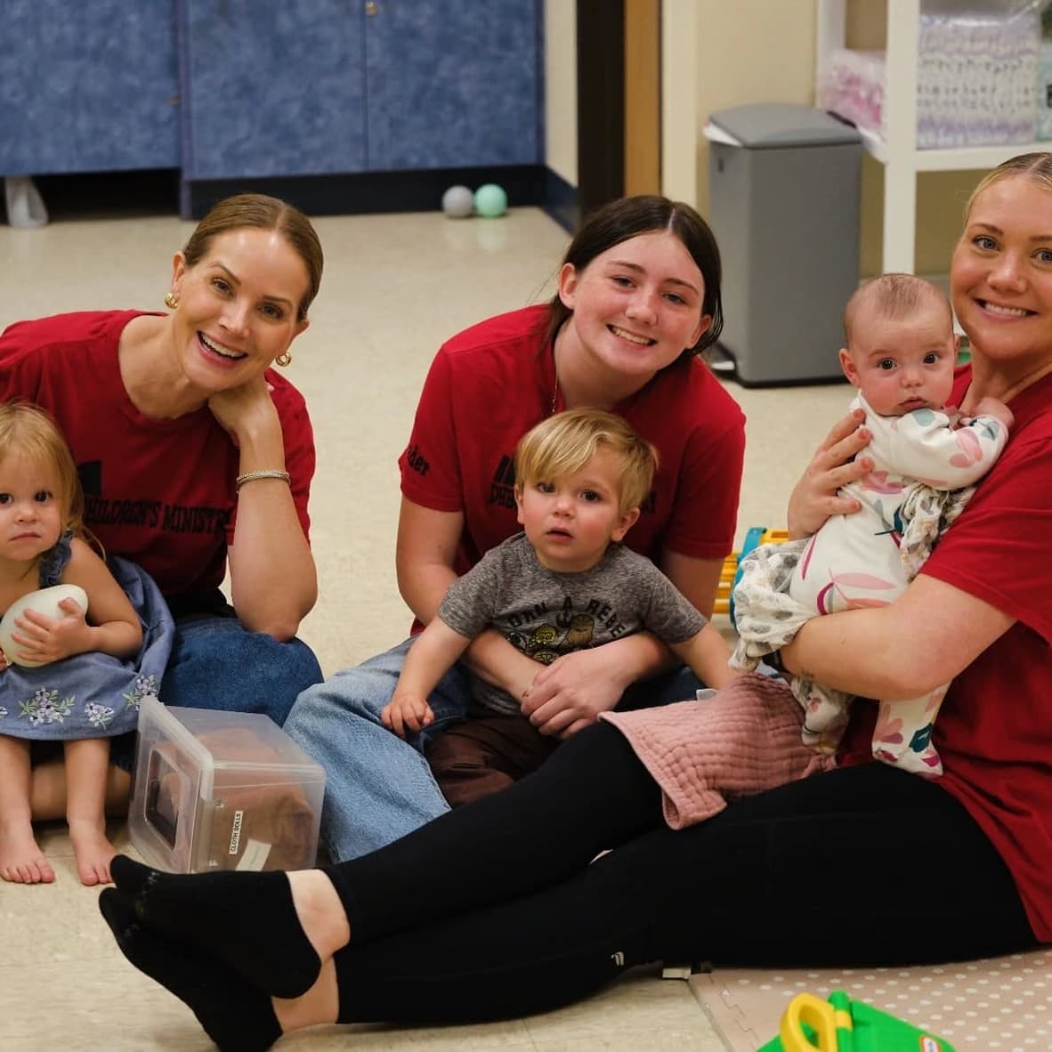 Women holding babies